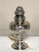 A small silver pepper pot