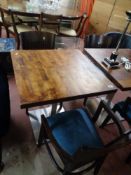 A cafe table together with a pair of chairs