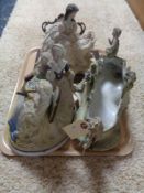 A tray of three decorative figures,