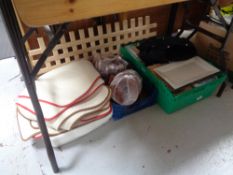 A crate of kitchen ware : forks and spoons, disposable cutlery,