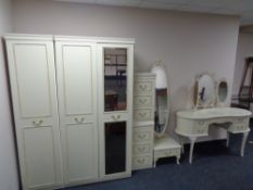 A five piece cream and gilt bedroom suite