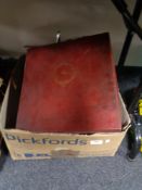 A box of aluminium cooking pans and a box of glass