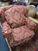 A reproduction Victorian style armchair in burgandy fabric