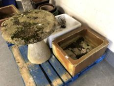 Two ceramic sinks together with a saddle stone