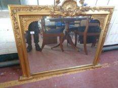 An antique gilt framed overmantel mirror