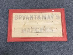 A Bryant & May's Matches advertisement on board in frame