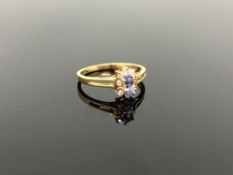 A 10ct gold tanzanite and diamond ring,