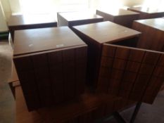 A pair of wooden bedside cabinets