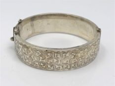 A silver bangle with engraved decoration, Birmingham 1967 CONDITION REPORT: 29.