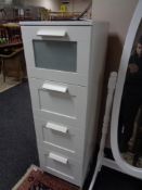 An Ikea four drawer white chest