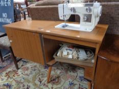 A New Home teak cased sewing machine table