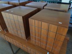 A pair of wooden bedside cabinets