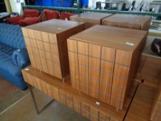 A pair of wooden bedside cabinets