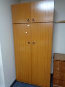 A teak effect wardrobe,