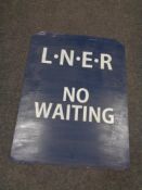 A hand painted metal sign 