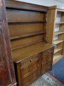 A reproduction oak kitchen dresser