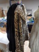 Two fur coats and a further faux leopard skin coat