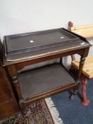 An early twentieth century mahogany trolley with tray