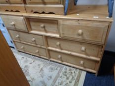 A pine multi drawer chest 148 cm x 78 cm x 49 cm