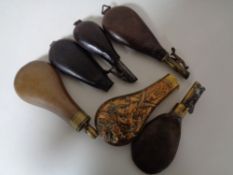 Six antique powder flasks (6)