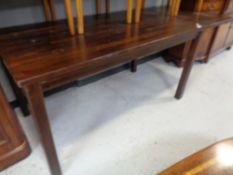 A hardwood extending pine dining room table