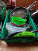 A crate of Jamie Oliver frying pans,