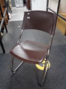 A contemporary mahogany effect fire surround