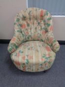A Victorian lady's bedroom chair in floral button fabric