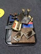 A tray of ornamental horse figures, harmonica in case,