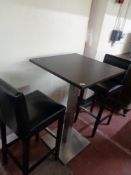 A single poser bar table together with a pair of black leather bar stools (3)