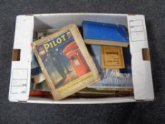 A box of comics, postcard books,