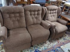 A brown cloth two seater settee and matching armchair