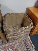 A wicker log trolley on wheels