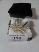 A Sterling silver Maltese cross on chain together with a pair of cufflinks