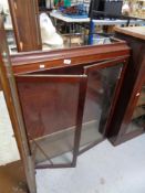 An Edwardian bookcase top