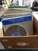 A box of LP records mainly classical