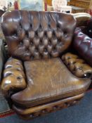 A Chesterfield style tan leather armchair