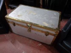 A metal bound shipping trunk