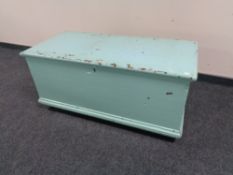 An antique painted pine blanket box