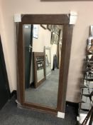 A brown contemporary flat framed mirror