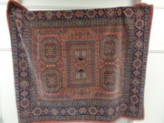 A Persian woolen rug on pink ground