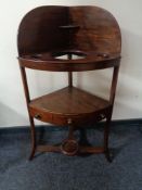 A Georgian mahogany corner wash stand
