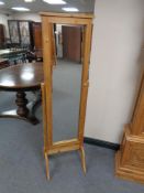 A pine storage cheval mirror