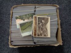 A box of twentieth century black and white & colour postcards