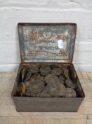 A tin of Victorian and Georgian pennies and half pennies