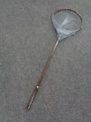 A vintage fishing landing net by C.