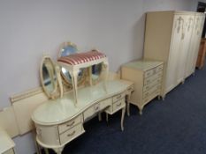 A six piece cream and gilt bedroom suite