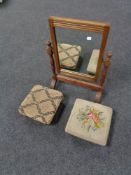 An Edwardian oak dressing table mirror and two antique footstools