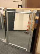 A contemporary all glass mirror,