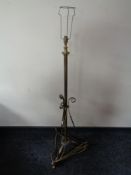 An early 20th century brass standard lamp